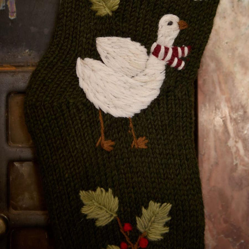 Close-up of hand-embroidered Christmas goose with scarf on Goose Stocking in Moss color.