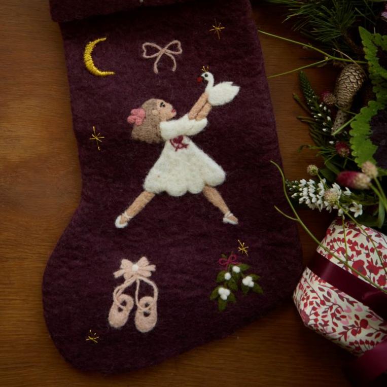 Dark grape holiday stocking with embroidered Odette and festive motifs displayed in a Christmas setting, adding elegance and charm to holiday decor.