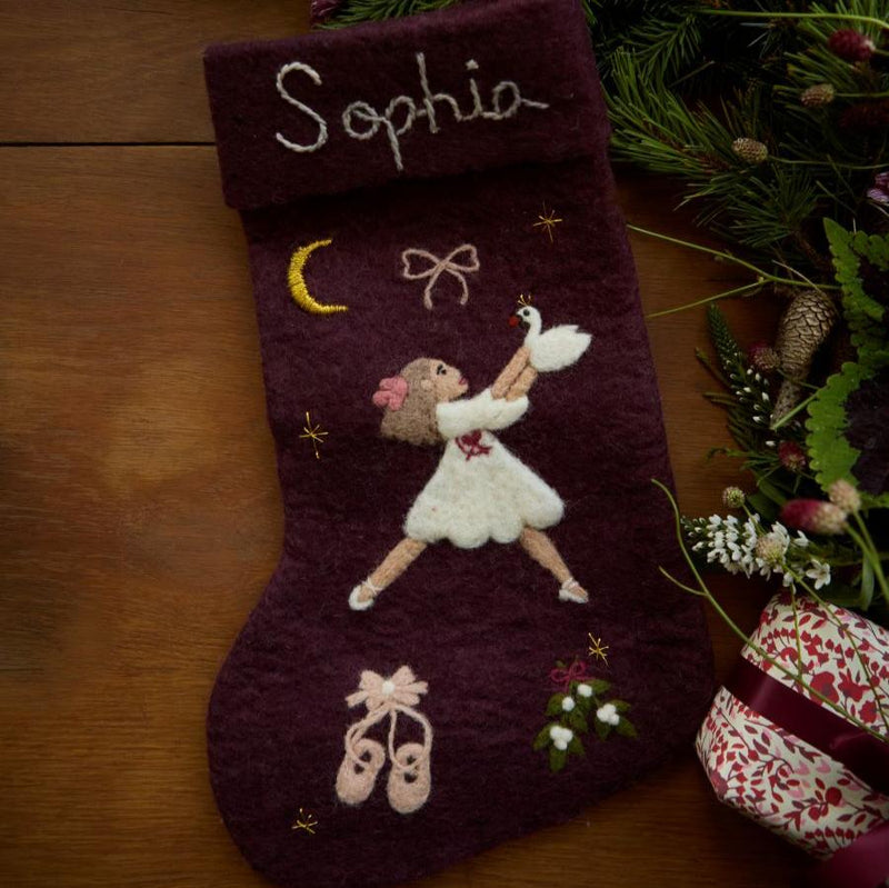 Dark grape holiday stocking with personalized embroidered Odette and custom name, displayed in a festive Christmas setting, adding a unique touch to holiday decor.