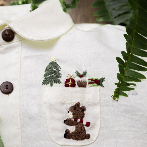 white sewn shirt for boys with hand embroidered teddy and other christmas motifs