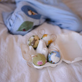 embroidered egg ornaments in a box