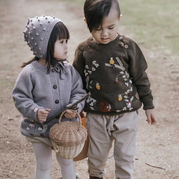 little girl and boy in shirley bredal knitwear