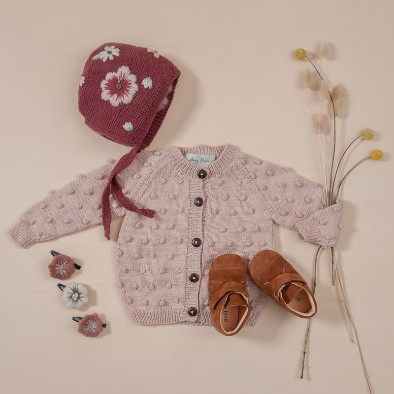 flatlay picture of dusty pink cardigan dusty pink
