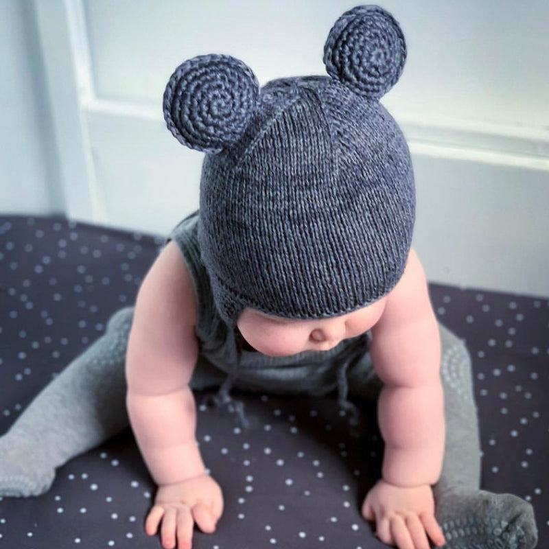 toddler wearing hand knitted hat in dark grey with ears on it