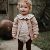 cute little baby girl wearing edith cardigan dusty pink