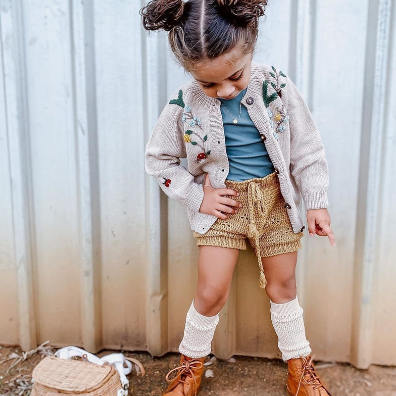 baby girl flaunting in woodland cardigan oats
