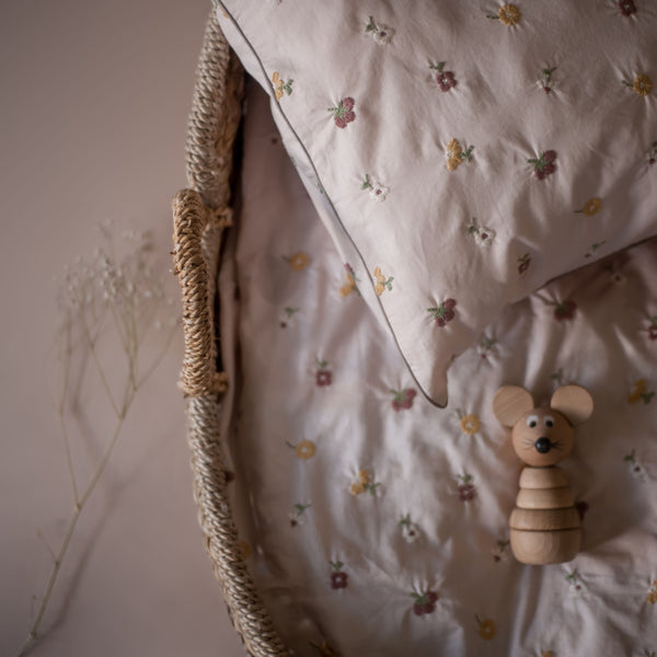 kids and baby bedding in dusty pink colours with embroidered flowers