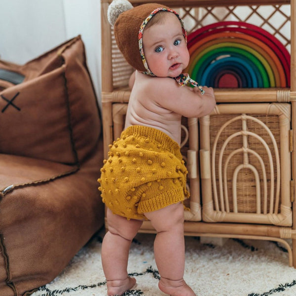 cute baby wearing bubble mustard