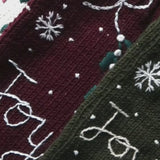 Close-up video highlighting various Gingerbread Stockings, showcasing their detailed knitted patterns and festive designs in a detailed and engaging manner.