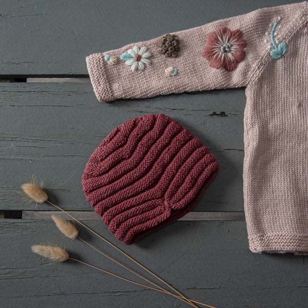  hand knitted hat in our dreamy soft merino wool along with hand knitted sweater with floral embroidery on it