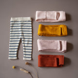 flat lay picture of baby leggings in different colors