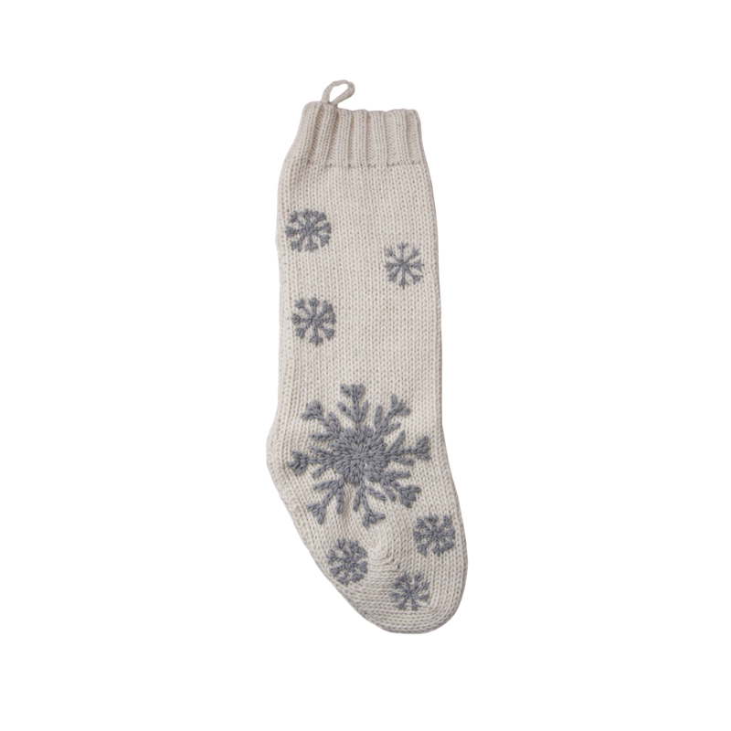 Hand-knitted Christmas stocking in Cream White color featuring a hand-embroidered snowflake and JOY pattern, designed to hold treasures from Santa.