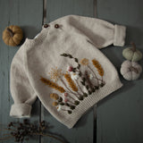 hand knitted nude sweater with hand embroidered wildflowers