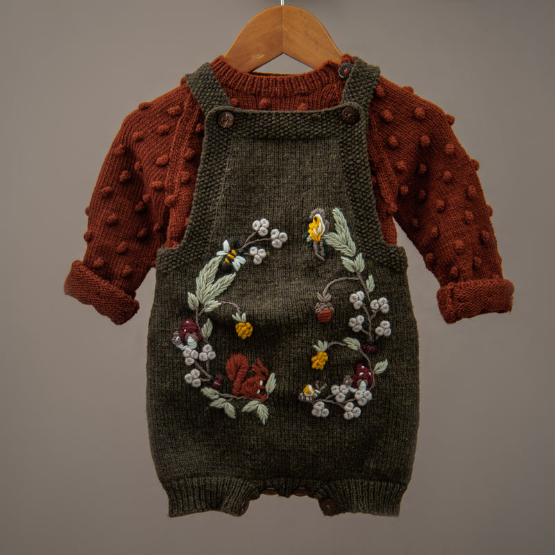 hand knitted and embroidered dark green romper for babies with popcorn sweater in brown